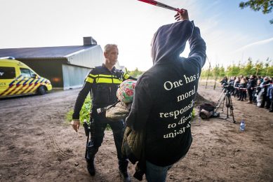 The gap in society in 2 pictures&  Activists swarming the farm   one half of the group entered the buildings, the other half even went inside&  Photo: Bert Jansen